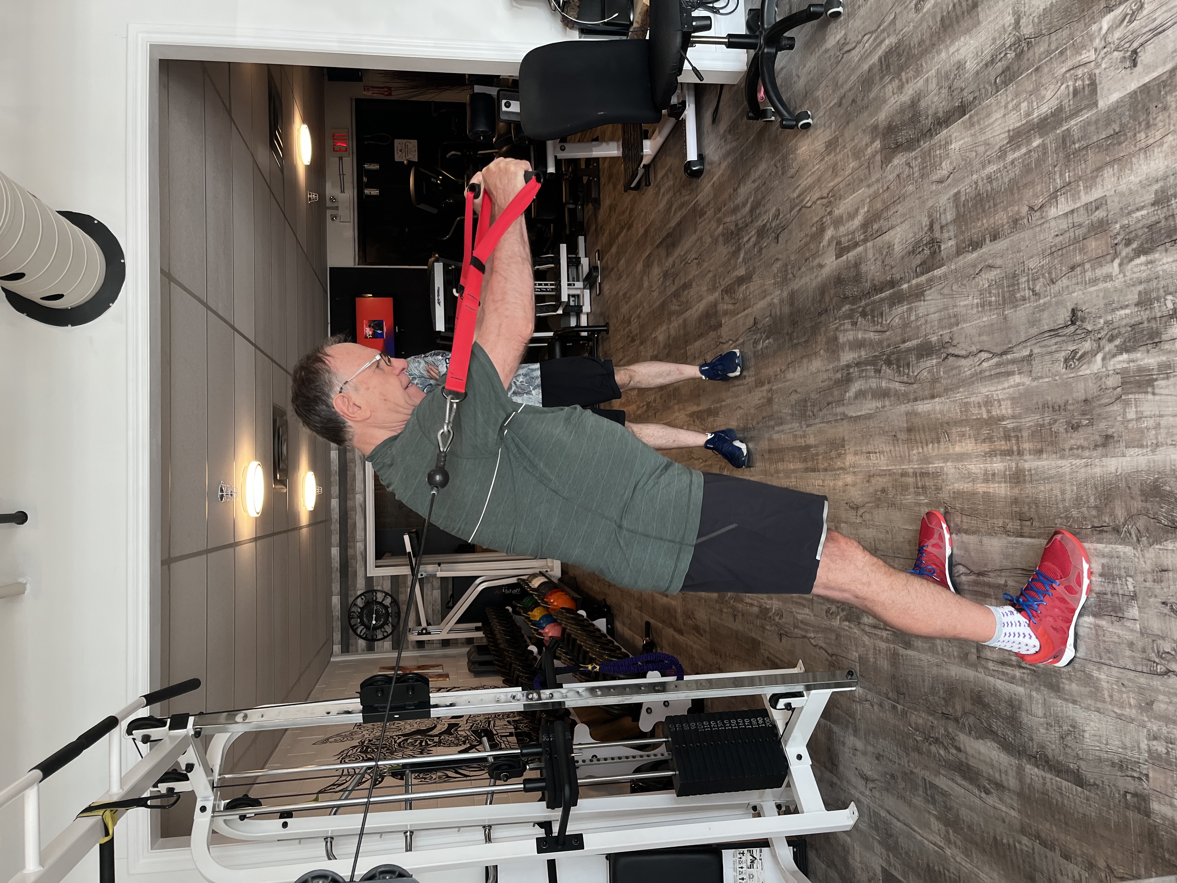 Client performing a cable pull exercise